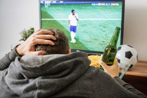 Unemployed man watching tv